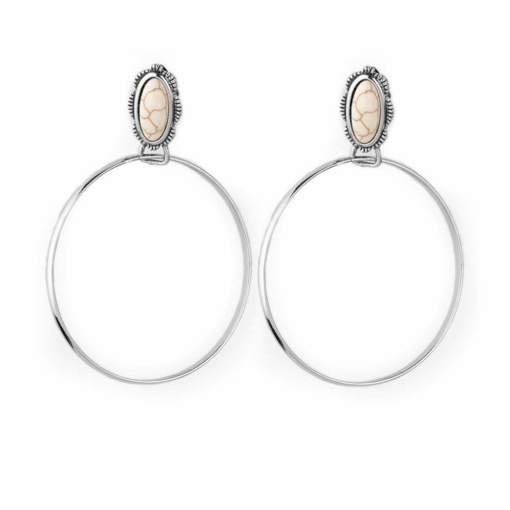 Shimmery white silver hoop earrings with an earthy white stone in the middle.